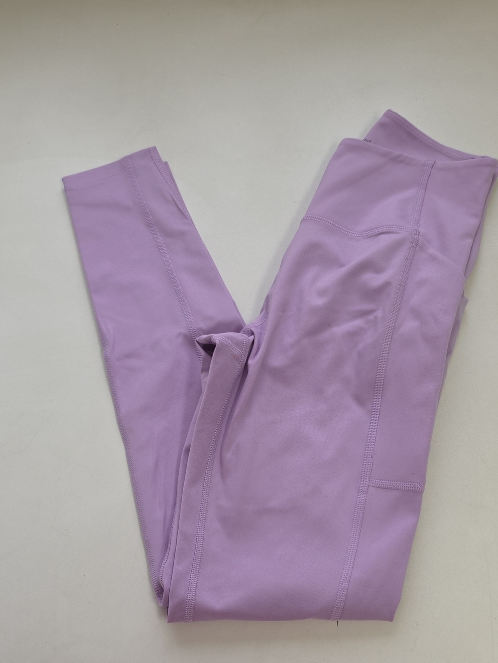 Girlfriend Collective Compressive High-Rise Pocket Leggings in the color Lilac.